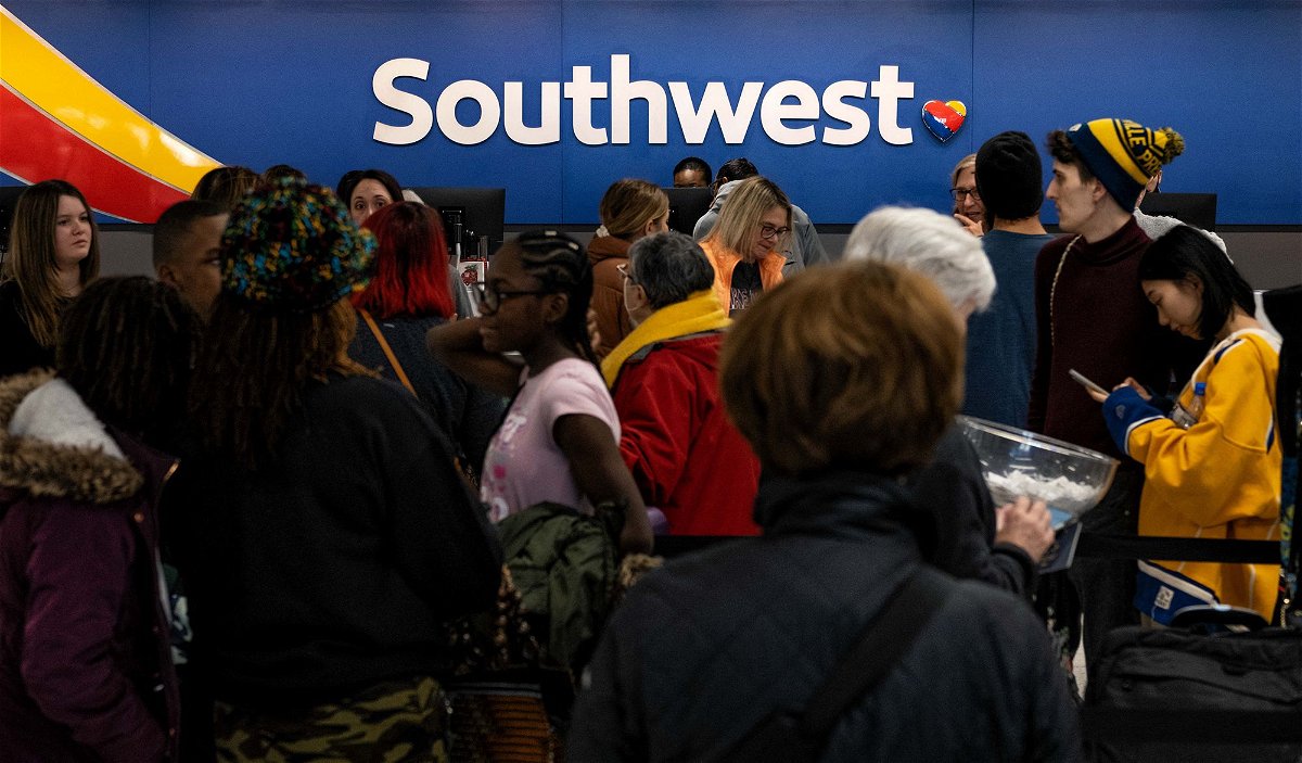 <i>Seth Herald/AFP/Getty Images</i><br/>Travelers wait in line at the Southwest Airlines ticketing counter at Nashville International Airport after the airline canceled thousands of flights last December.