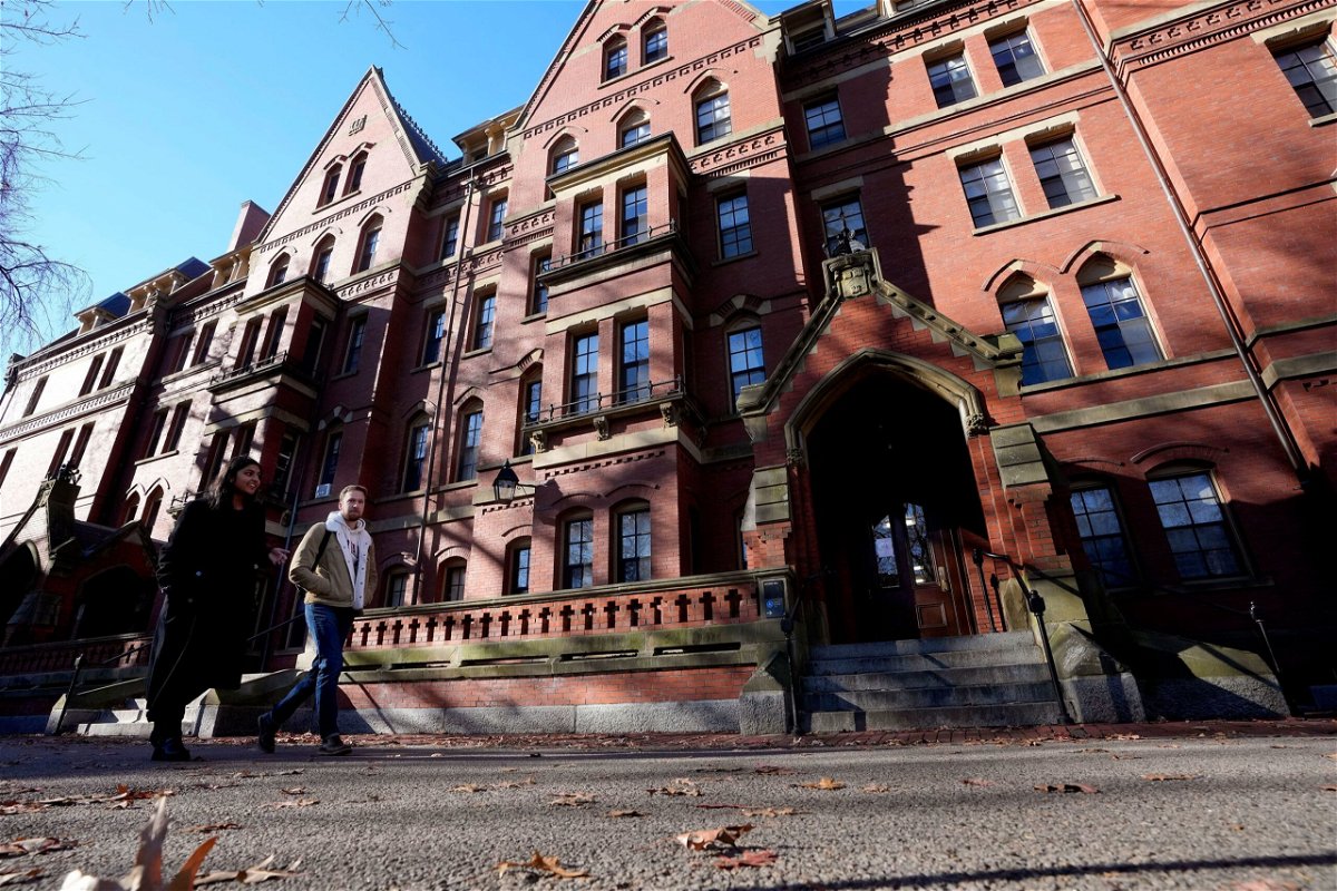 <i>Steven Senne/AP</i><br/>Passers-by walk on the campus of Harvard University