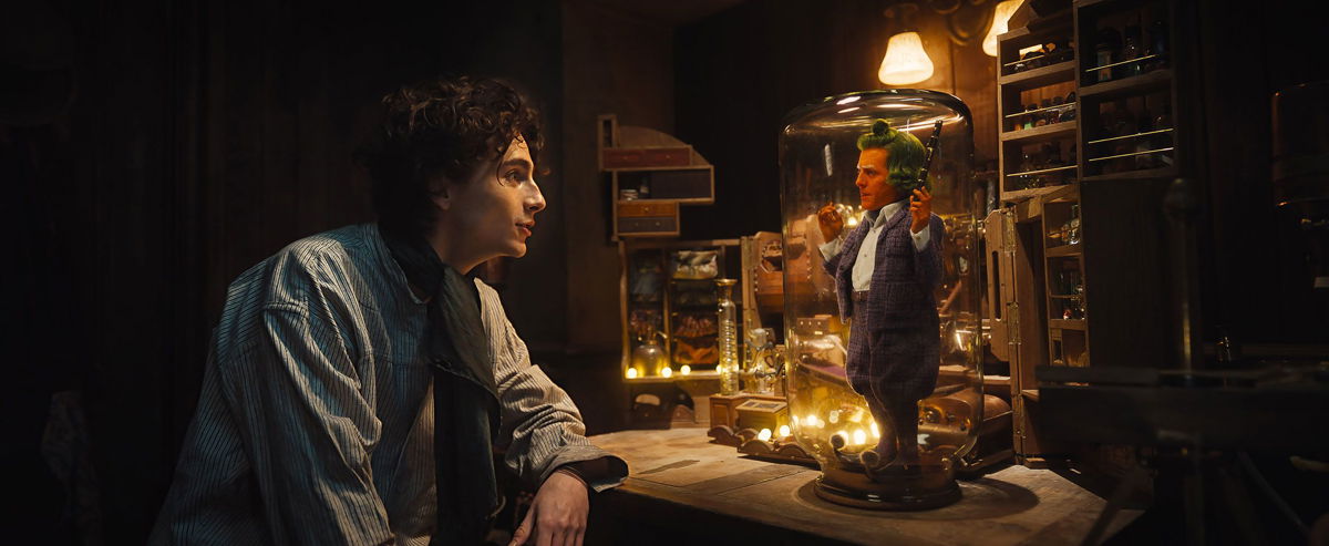 <i>Jaap Buittendijk/Warner Bros. Pictures</i><br/>Timothée Chalamet appears as Willy Wonka and Hugh Grant as an Oompa Loompa in 