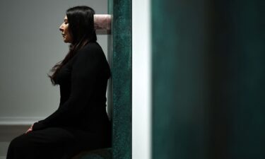 Marina Abramovic sits on one of her artworks