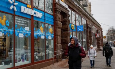 People walk past a store of Ukraine's telecommunications company Kyivstar