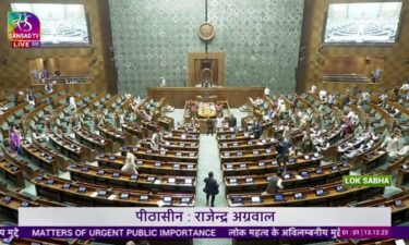 A man jumps into the lawmakers' area in the lower house of the Indian Parliament