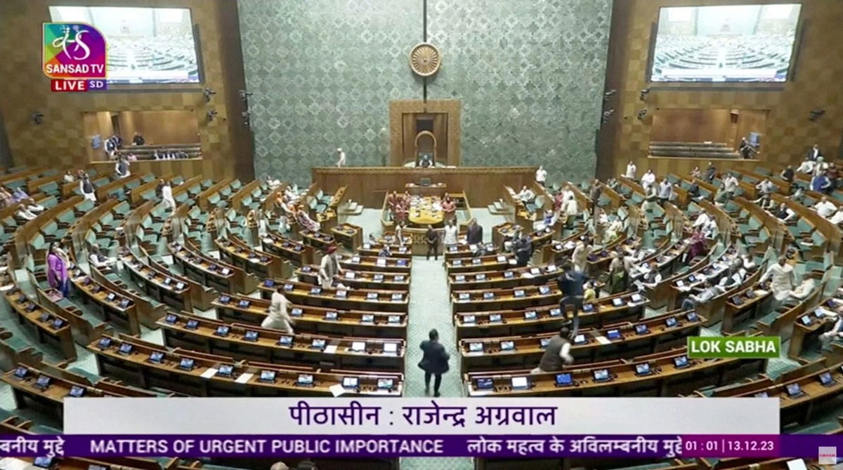 <i>Sansad TV/Reuters</i><br/>A man jumps into the lawmakers' area in the lower house of the Indian Parliament