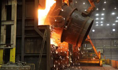 A ladle of molten iron is poured into a Basic Oxygen Process (BOP) furnace at US Steel's Granite City Works