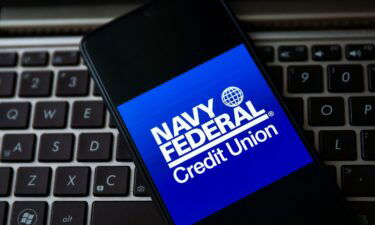 Navy Federal Credit Union logo is displayed on a mobile phone screen in April 2021.