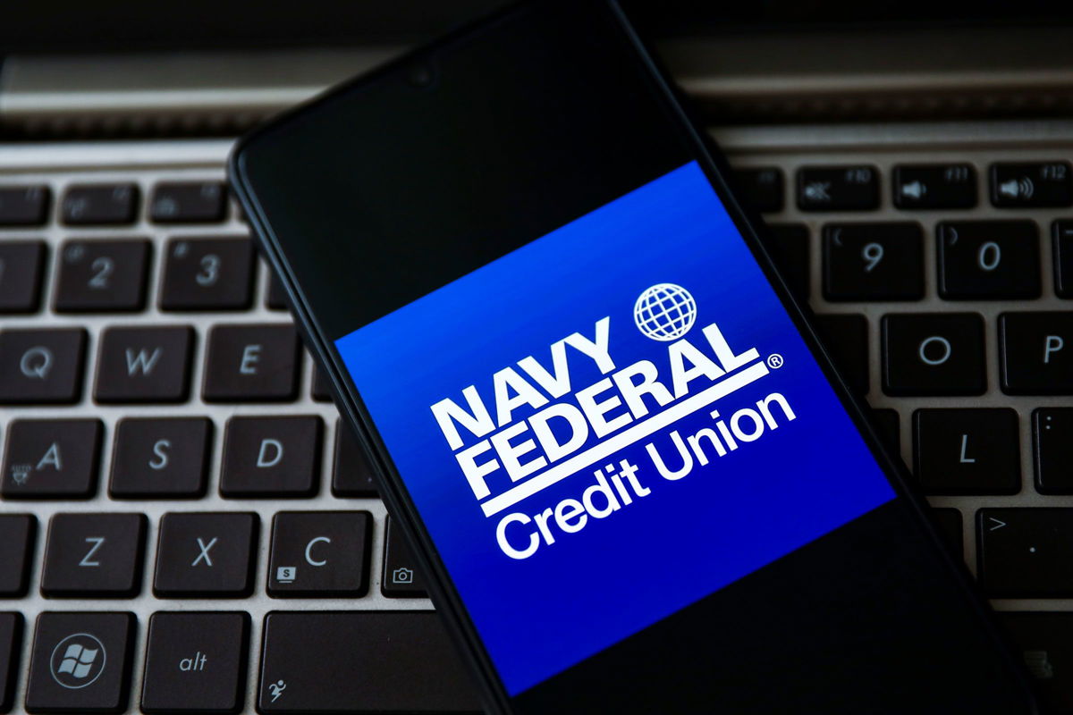 <i>Beata Zawrzel/NurPhoto/Getty Images</i><br/>Navy Federal Credit Union logo is displayed on a mobile phone screen in April 2021.