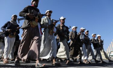 Newly recruited fighters who joined a Houthi force intended to be sent to fight in support of Palestinians in Gaza march in Sanaa