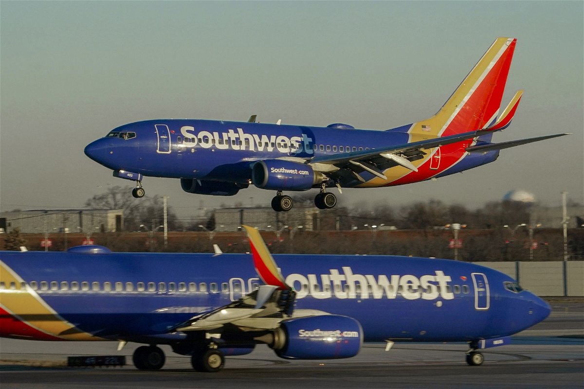 <i>Kiichiro Sato/AP</i><br/>Southwest Airlines plane prepares to land at Midway International Airport