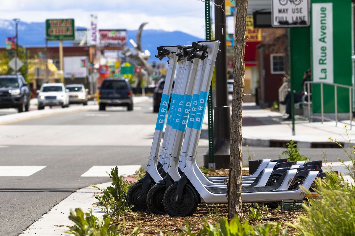 <i>Ty O'Neil/SOPA/LightRocket/Getty Images</i><br/>Bird scooters parked by the side of the street in April 2022.