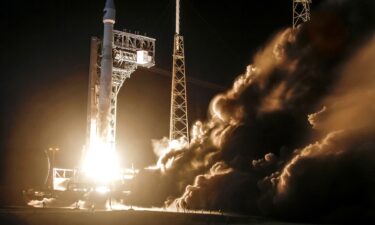 People react as a passenger rocket plane operated by Virgin Galactic lifts off during the company's first commercial flight at the Spaceport America facility in New Mexico on June 29.