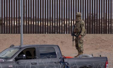 A member of the Texas National Guard is watching over the border between Mexico and the United States on Saturday