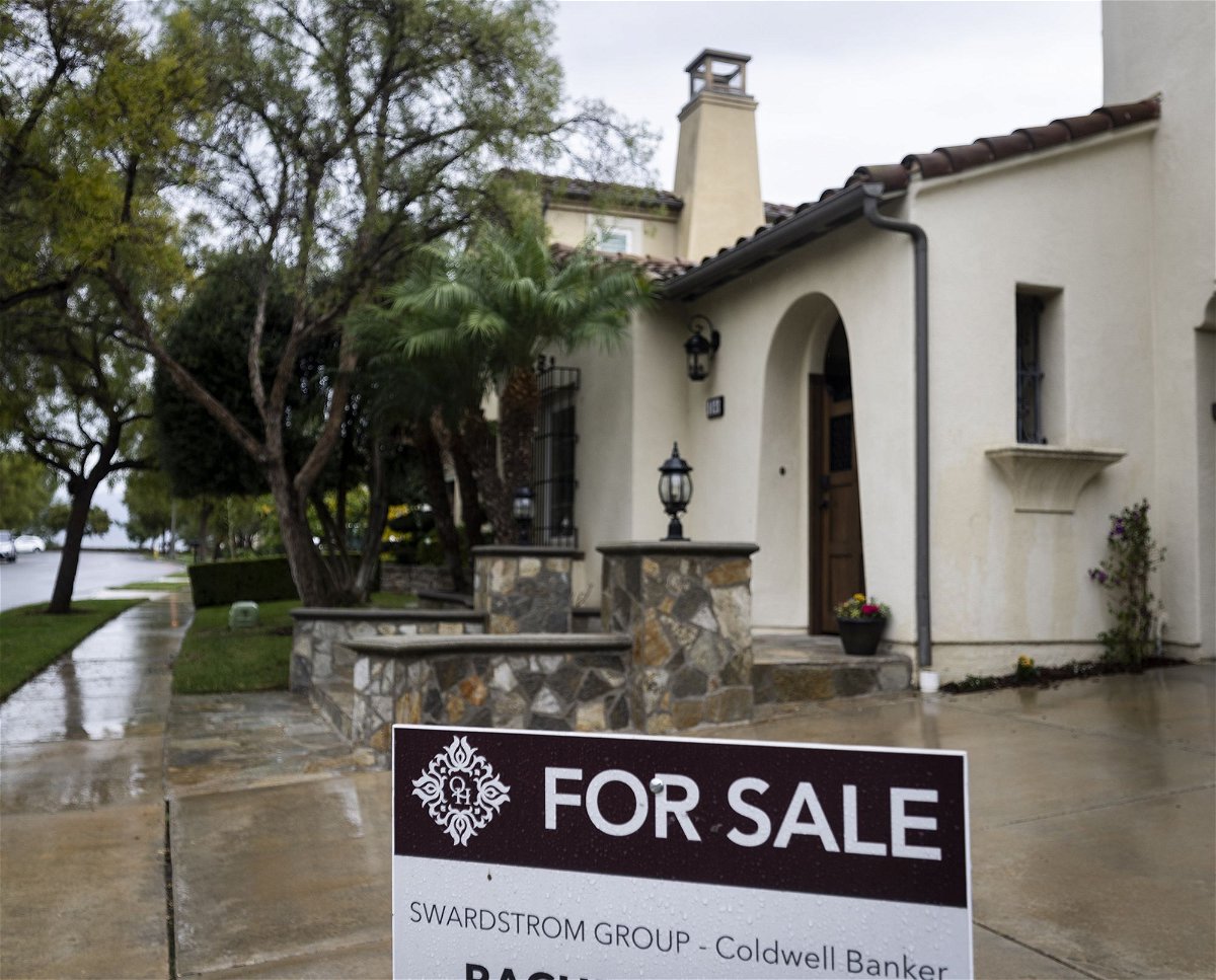 <i>Paul Bersebach/MediaNews Group/Orange County Register/Getty Images</i><br/>A for sale sign sits outside a home in Irvine