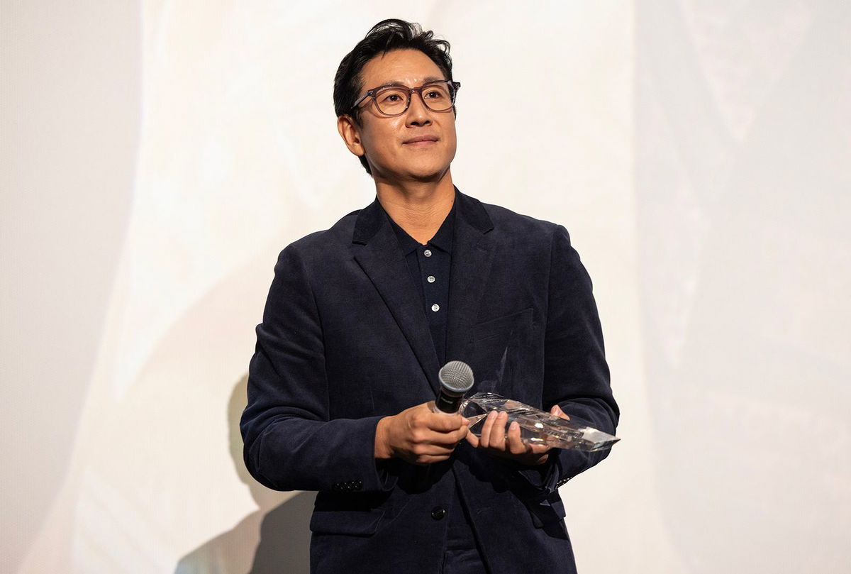 <i>Barry Brecheisen/Getty Images</i><br/>Actor Lee Sun Kyun receives the award for 