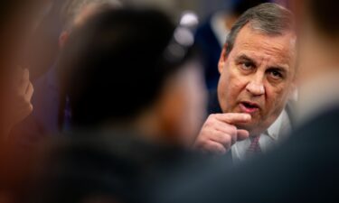 Republican presidential candidate former New Jersey Gov. Chris Christie speaks to reporters in the spin room following the NewsNation Republican Presidential Primary Debate at the University of Alabama Moody Music Hall on December 6