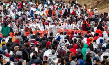 Immigrants wait to be processed at a U.S. Border Patrol transit center after they crossed the border from Mexico on December 20