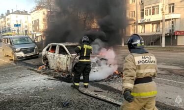 Firefighters extinguish burning cars after shelling in Belgorod on Saturday.