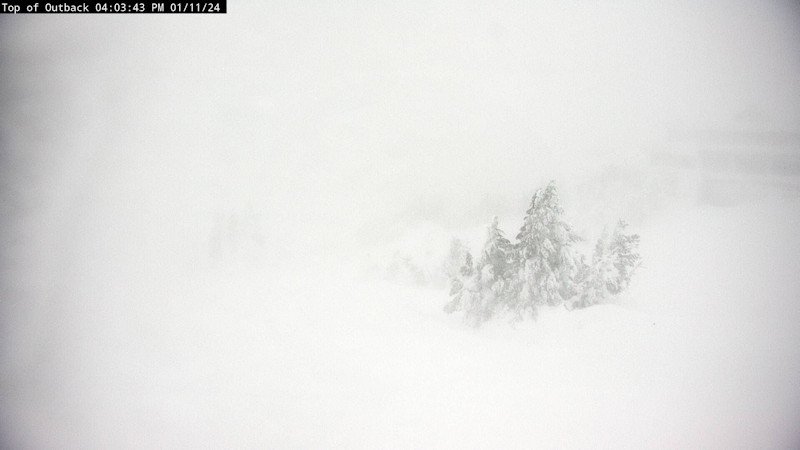 Pine Marten Lodge is barely visible amid high winds Thursday afternoon at Mt. Bachelor