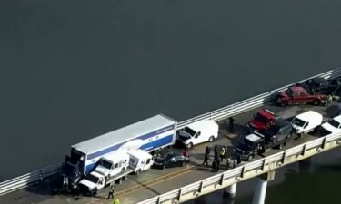 A blue sedan speeding and driving erratically possibly contributed to a 23-car crash on the Chesapeake Bay Bridge.