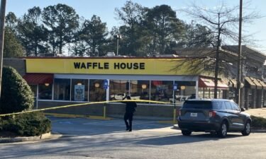 A Waffle House employee was shot in the arm by a customer Monday morning