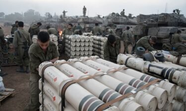 Israeli soldiers organize tank shells after returning from the Gaza Strip on January 1