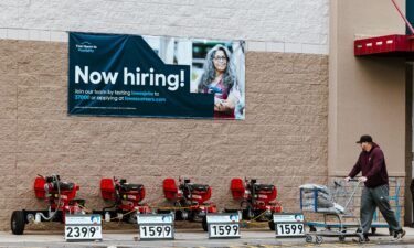 A "Now Hiring" sign at a Lowe's store in Glenmont