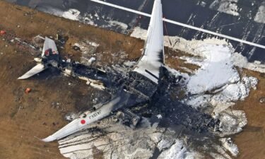 The Japan Airlines plane on fire after touching down at Tokyo's Haneda Airport on January 2.