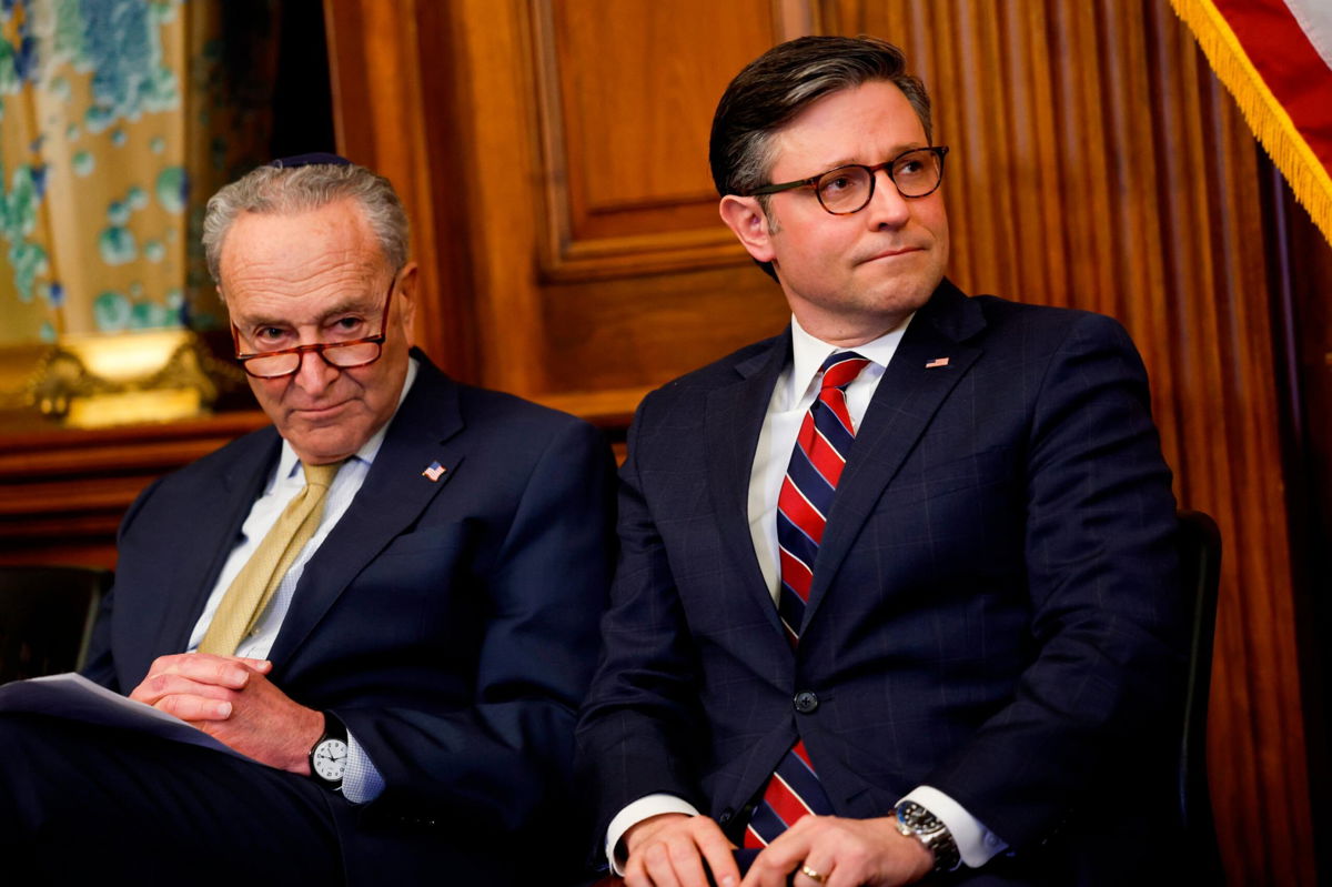 <i>Anna Moneymaker/Getty Images</i><br/>Senate Majority Leader Chuck Schumer and House Speaker Mike Johnson are seen at an event in the US Capitol Building on December 12