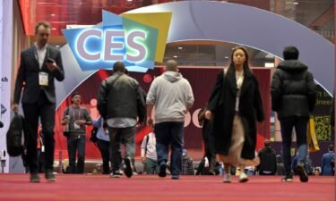Attendees arrive for the opening of CES 2023 at the Las Vegas Convention Center on January 5