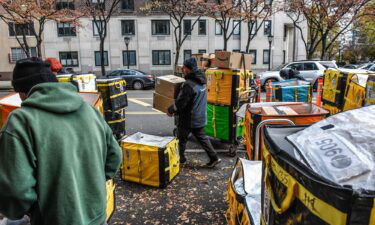 Amazon workers deliver packages on Cyber Monday in New York in November 2023. Americans spent a record $222 billion shopping online this holiday season.