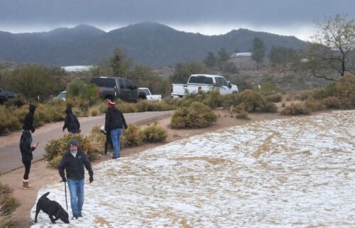 Snow and hail accumulate on the ground in Scottsdale