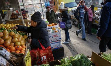 Patrons shop for produce at a Mr. Pina Market in Brooklyn