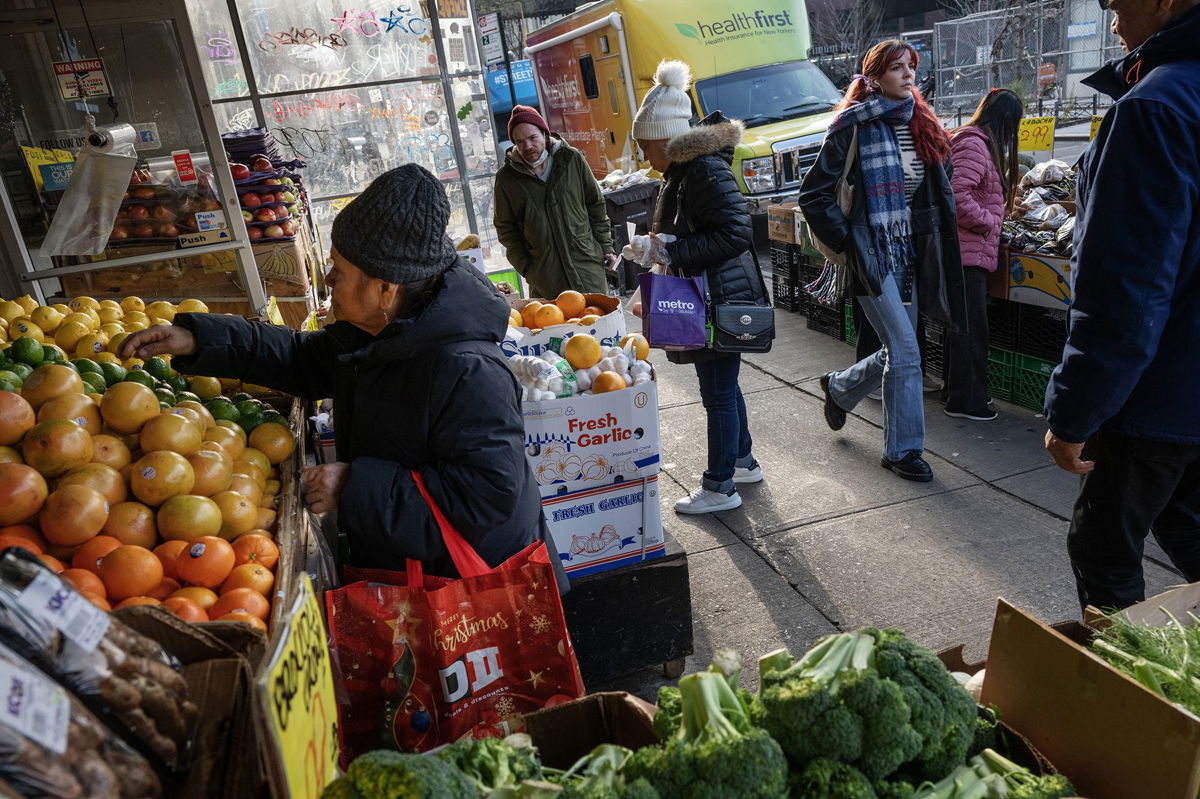 <i>Victor J. Blue/Bloomberg/Getty Images</i><br/>Patrons shop for produce at a Mr. Pina Market in Brooklyn