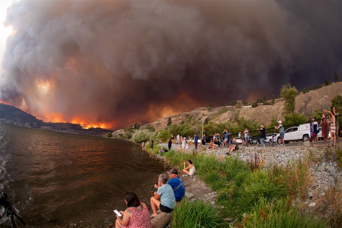 <i>Darren Hull/AFP/Getty Images</i><br/>Residents watch the McDougall Creek wildfire in West Kelowna