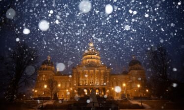 Snow falls on the Iowa State Capitol in Des Moines amid a powerful winter storm on January 8.