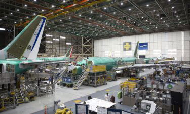 Employees work on Boeing 737 MAX airplanes at the Boeing Renton Factory in Renton
