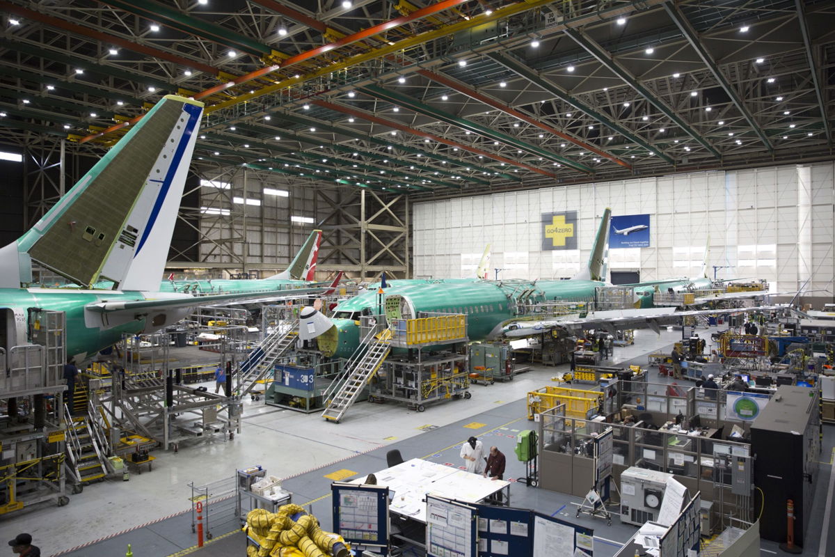 <i>Jason Redmond/AFP/Getty Images</i><br/>Employees work on Boeing 737 MAX airplanes at the Boeing Renton Factory in Renton