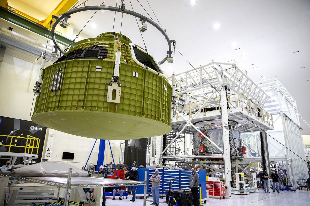 <i>Glenn Benson/NASA</i><br/>The Orion pressure vessel for NASA’s Artemis III mission is shown being lifted by crane for its move onto a work stand at NASA’s Kennedy Space Center in Florida in 2021.