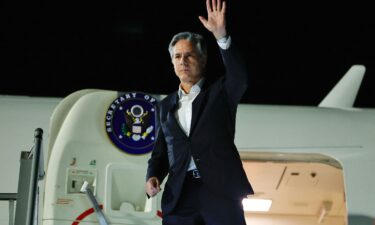 US Secretary of State Antony Blinken waves as he departs from al-Ula in northwestern Saudi Arabia for Tel Aviv on January 8 during his week-long trip aimed at calming tensions across the Middle East.