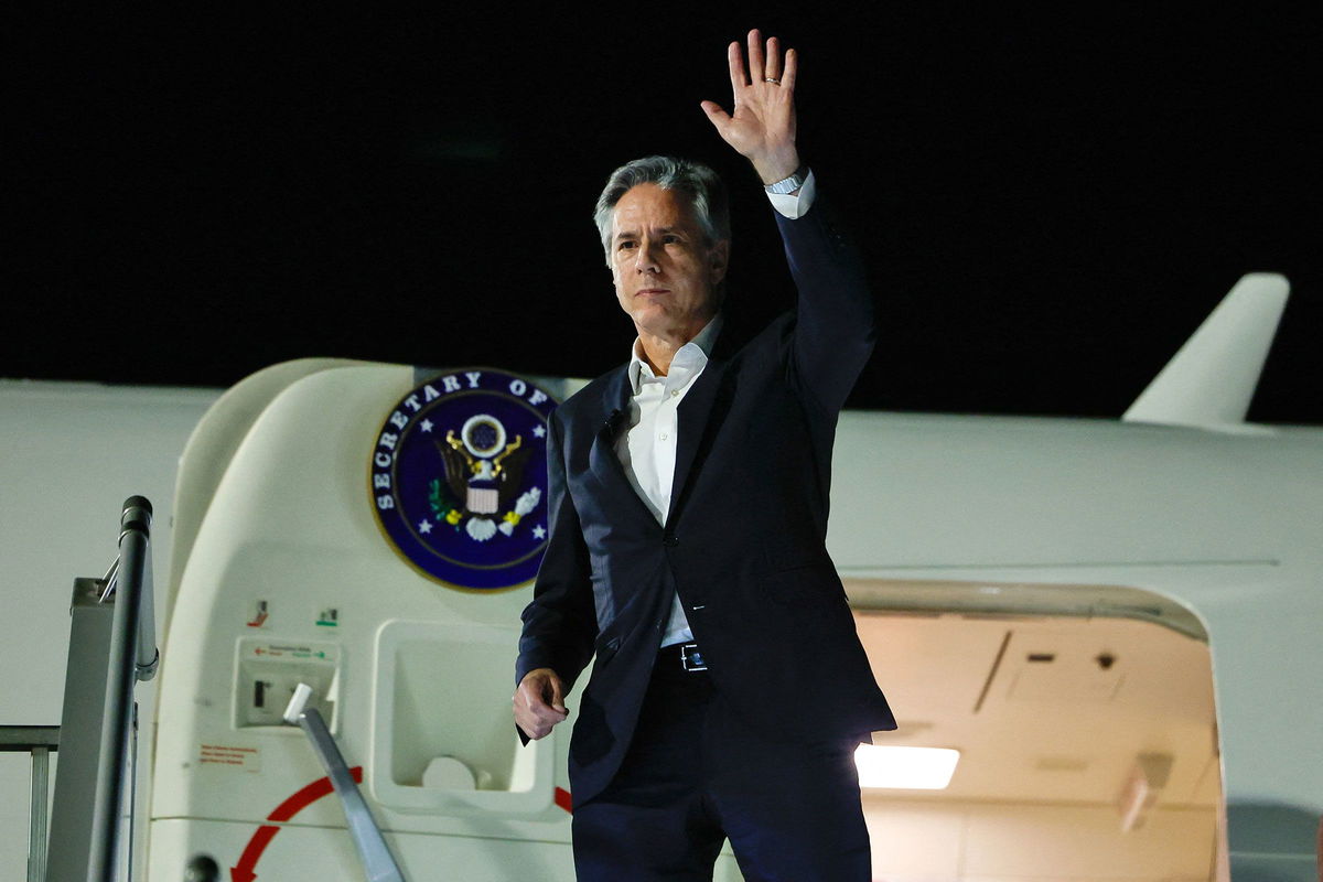 <i>Evelyn Hockstein/Pool/Getty Images</i><br/>US Secretary of State Antony Blinken waves as he departs from al-Ula in northwestern Saudi Arabia for Tel Aviv on January 8 during his week-long trip aimed at calming tensions across the Middle East.