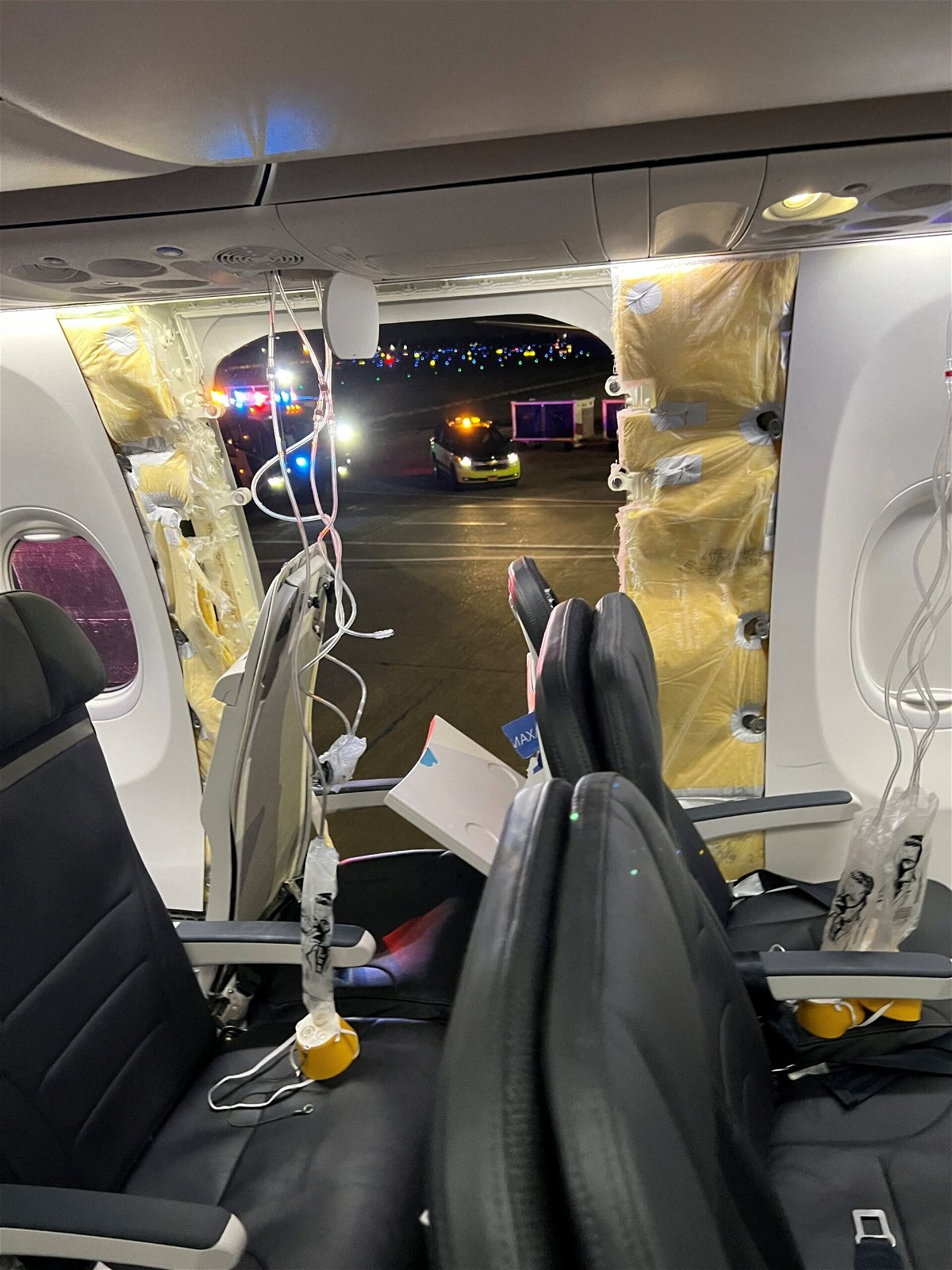 <i>@strawberrvy/Instagram via Reuters</i><br/>Passenger oxygen masks hang from the roof next to a missing window and a portion of a side wall of an Alaska Airlines Flight 1282