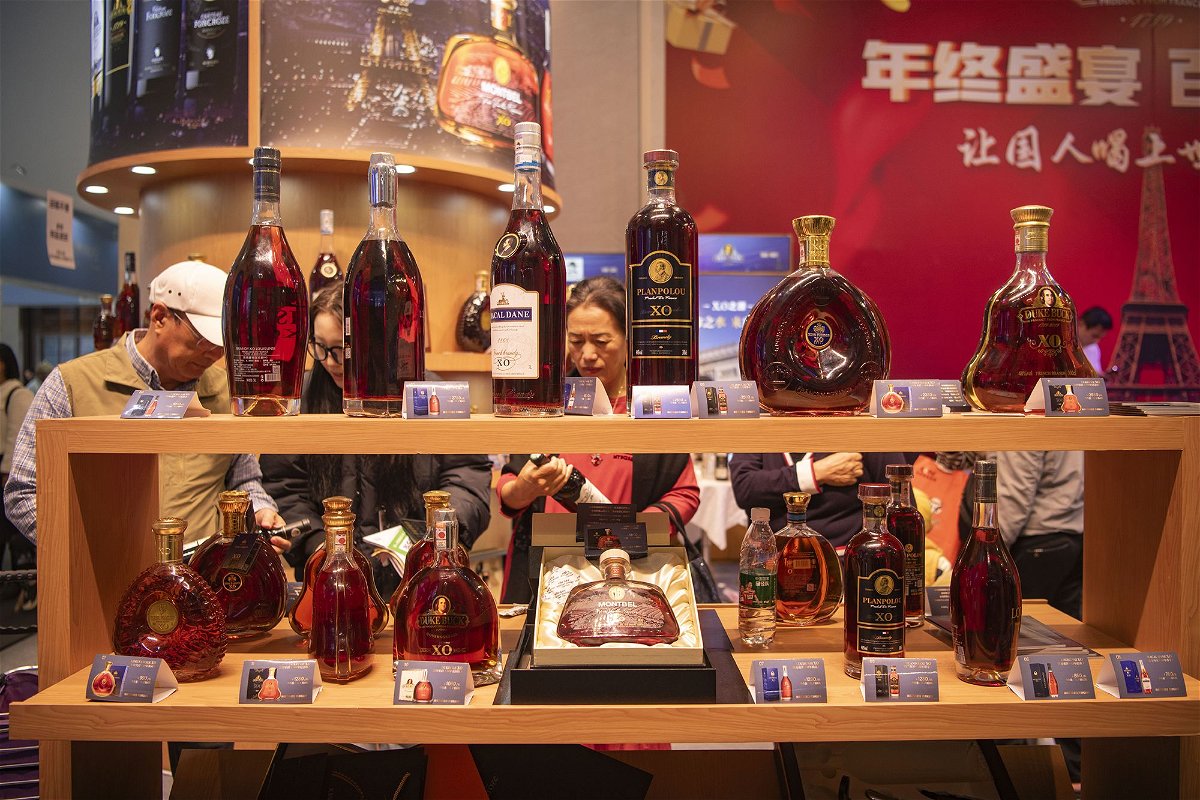 <i>Meng Zhongde/VCG/Getty Images</i><br/>People purchase brandy during a trade fair in Hainan