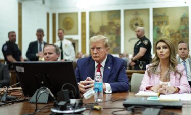 Former US President Donald Trump sits at the defense table with his attorneys Christopher Kise (L) and Alina Habba (R) in New York State Supreme Court on December 7