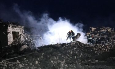 Rescuers work at the site of a Russian missile strike in Pokrovsk town on January 6. Eleven people including five children were killed in Russian S-300 missile strikes on Saturday.