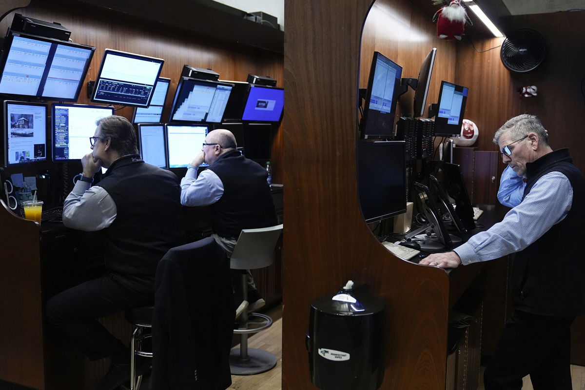 <i>Seth Wenig/AP</i><br/>Traders work on the floor at the New York Stock Exchange