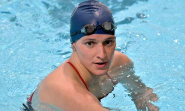 University of Pennsylvania transgender swimmer Lia Thomas speaks to her coach after winning the 500 meter freestyle during an NCAA college swimming meet with Harvard on January 22