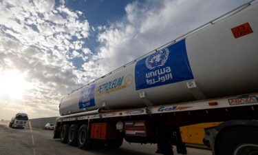 Trucks of the United Nations Relief and Works Agency for Palestine Refugees (UNRWA) carrying fuel arrive at the Egyptian side of the Rafah border crossing with the Gaza Strip on November 22