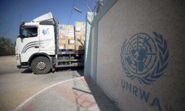 Workers of the United Nations Relief and Works Agency for Palestine Refugees (UNRWA) pack the medical aid and prepare it for distribution to hospitals at a warehouse in Deir Al-Balah