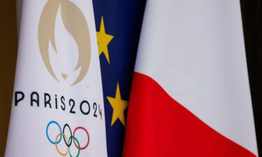 This Paris 2024 Olympic Games flag next to European Union and French flag at the presidential Elysee Palace in Paris in 2024.
