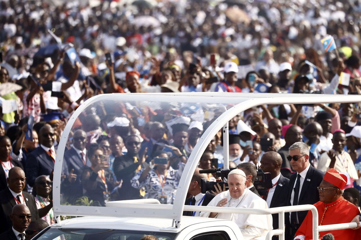 <i>Alexis Huguet/AFP/Getty Images</i><br/>Pope Francis (C) arrives by popemobile for a meeting with young people and catechists at Martyrs' Stadium in Kinshasa