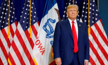 Republican presidential candidate and former President Donald Trump walks onstage at a campaign rally before giving remarks on January 05